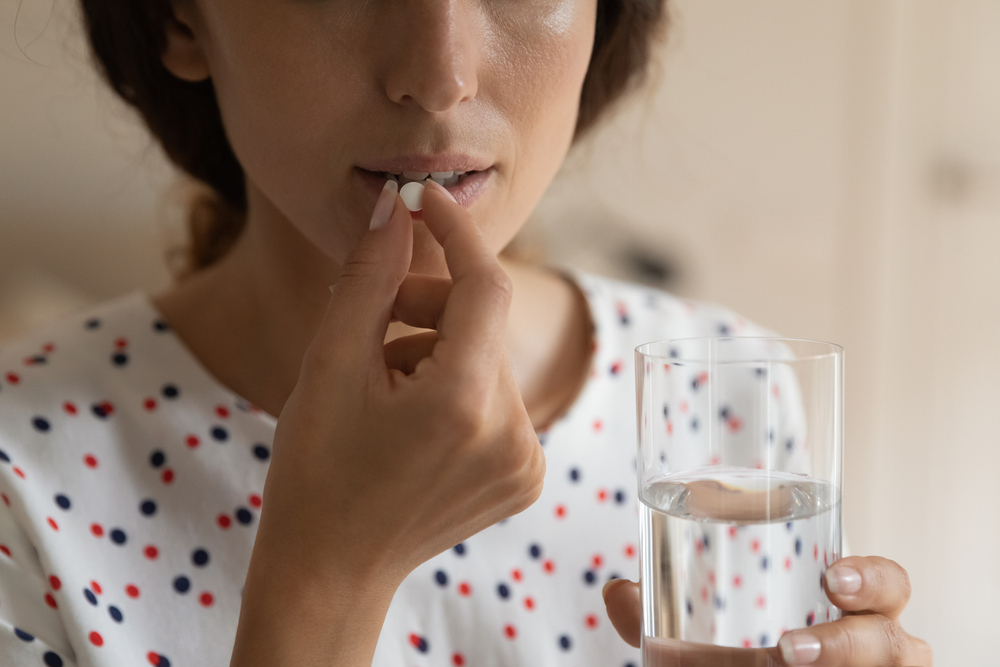 woman taking vitamin 